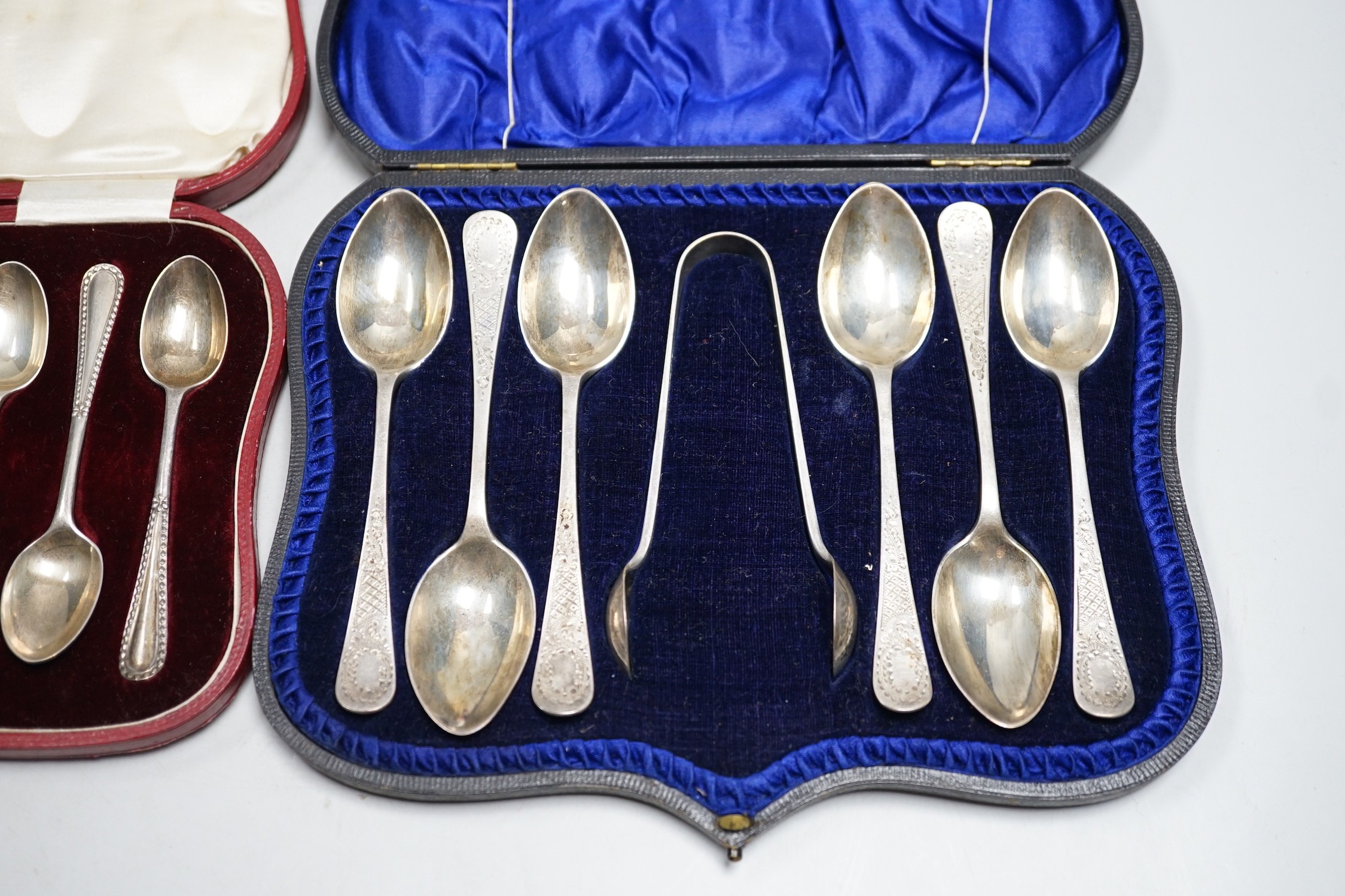 Two cased sets of six silver teaspoons and sugar tongs, including Sheffield, 1908.